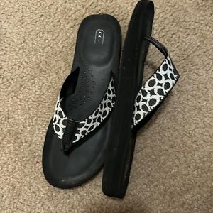 Black and white Coach wedge flip flop